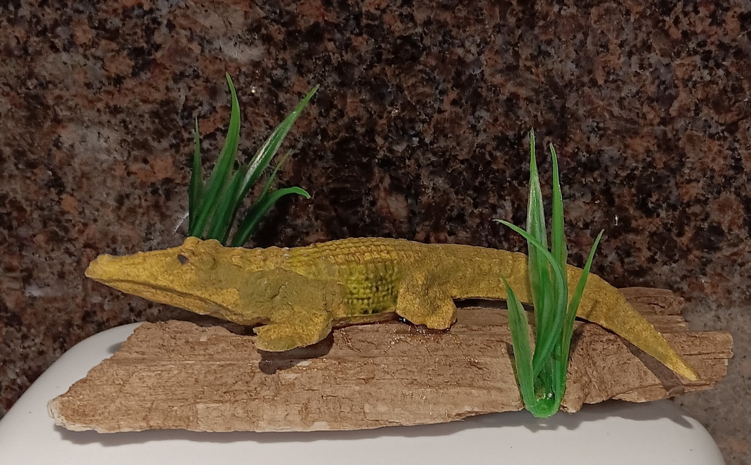 "In Hiding"
This driftwood, pottery, and plastic grass piece would make a decro piece in a hunting camp.